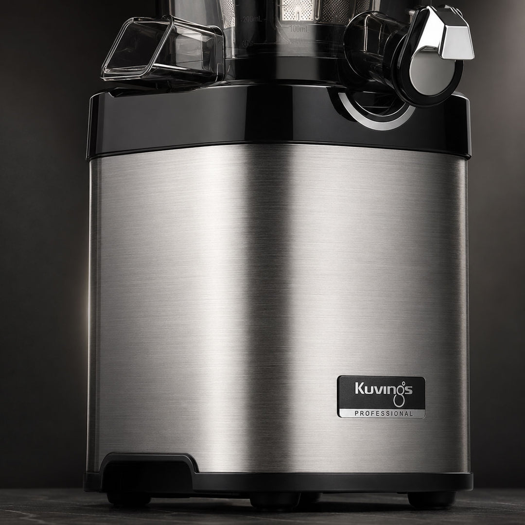 A Kuvings Professional Chef slow juicer with a brushed stainless steel body and black plastic components, shown against a dark studio background.